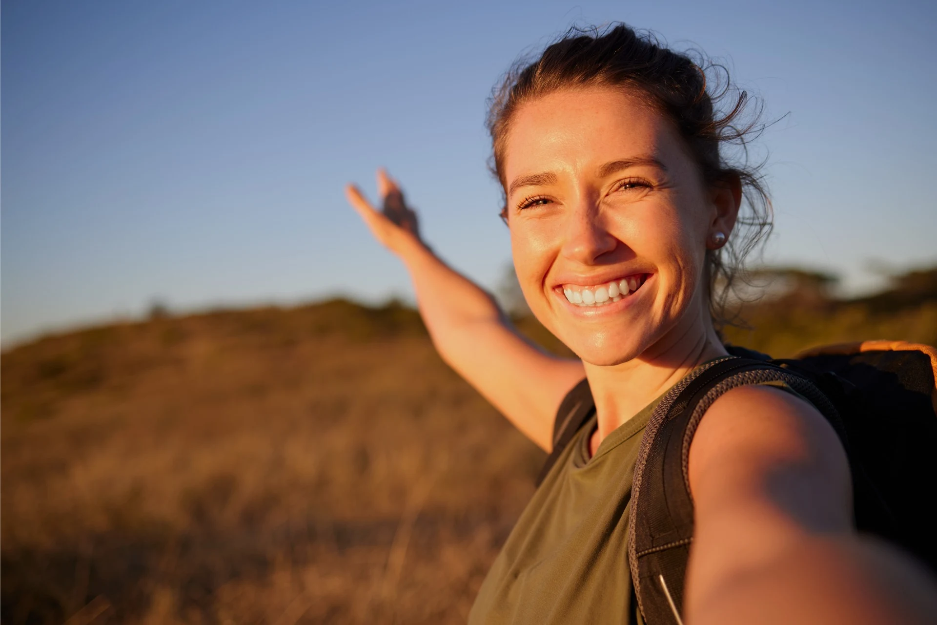 woman taking selfie while hiking
